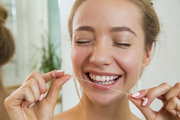 woman holding floss