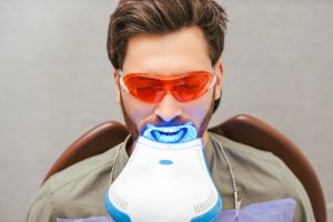 a man undergoes professional teeth whitening